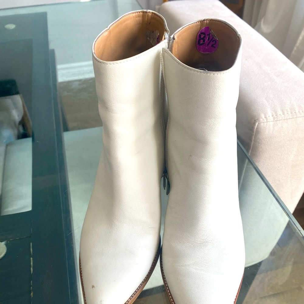 White leather shirt cowboy style but modern heel boots.